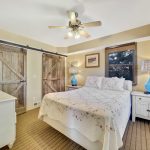 Main floor bedroom with a queen bed